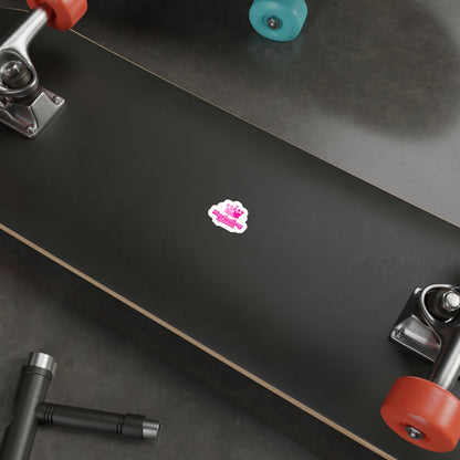 Marketing Queen sticker stuck on a skateboard, showcasing water-resistant vinyl and vibrant colors.