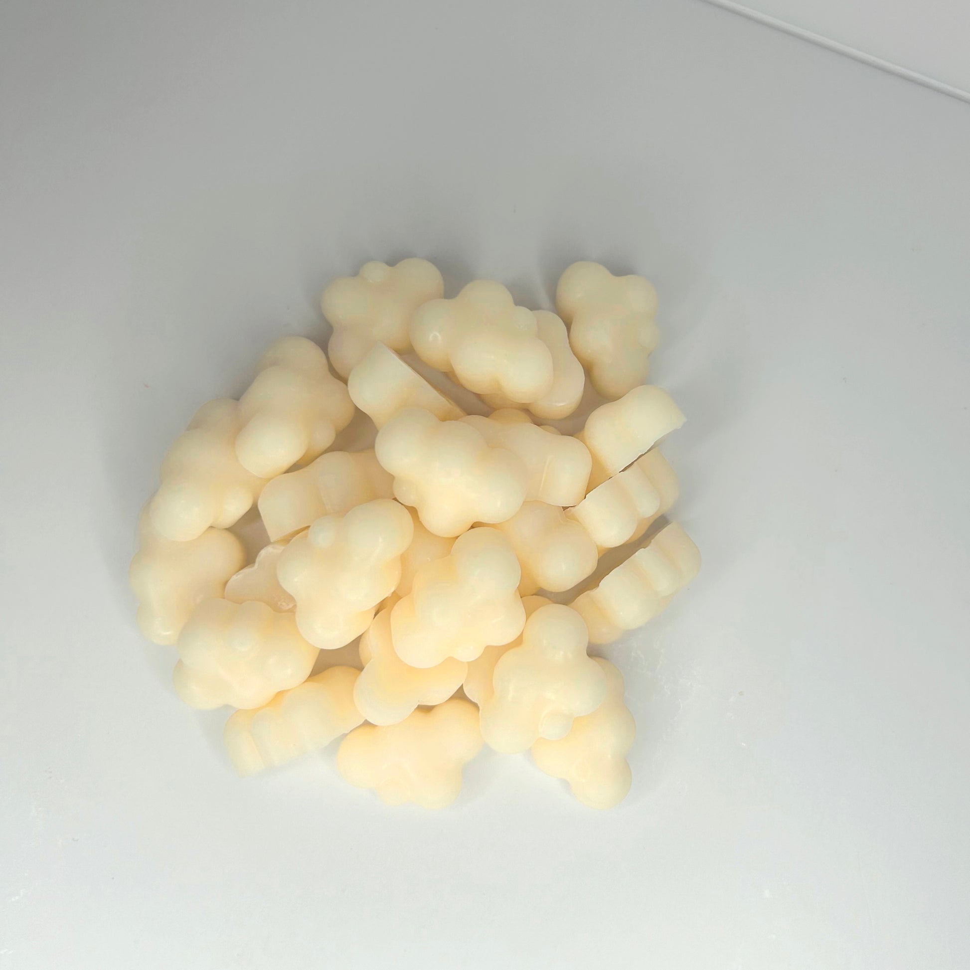 Close-up top view of Marshmallow Cloud wax melts without the jar, highlighting their soft texture and details.