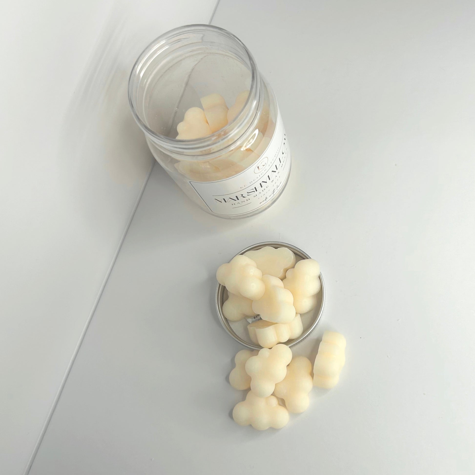 Top view of Marshmallow Cloud wax melts outside the jar, emphasizing their arrangement and design.