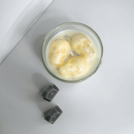 Top view of the Melting Souls Candle showcasing the intricate details of the melting skulls.
