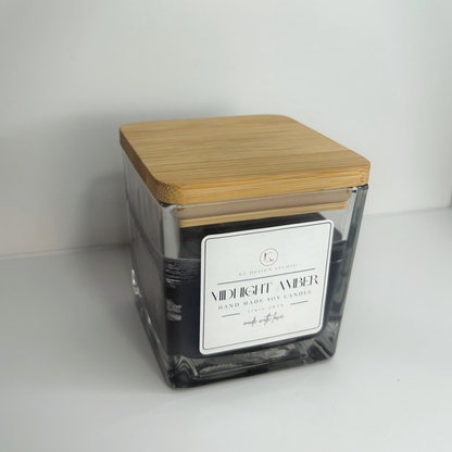 Top view of the 10oz Midnight Amber Candle with the lid on, revealing its elegant design and rich scent profile.