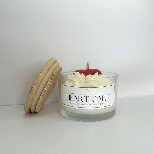 Front view of the Heart Cake Candle showcasing its decorative design and creamy vanilla buttercream scent.