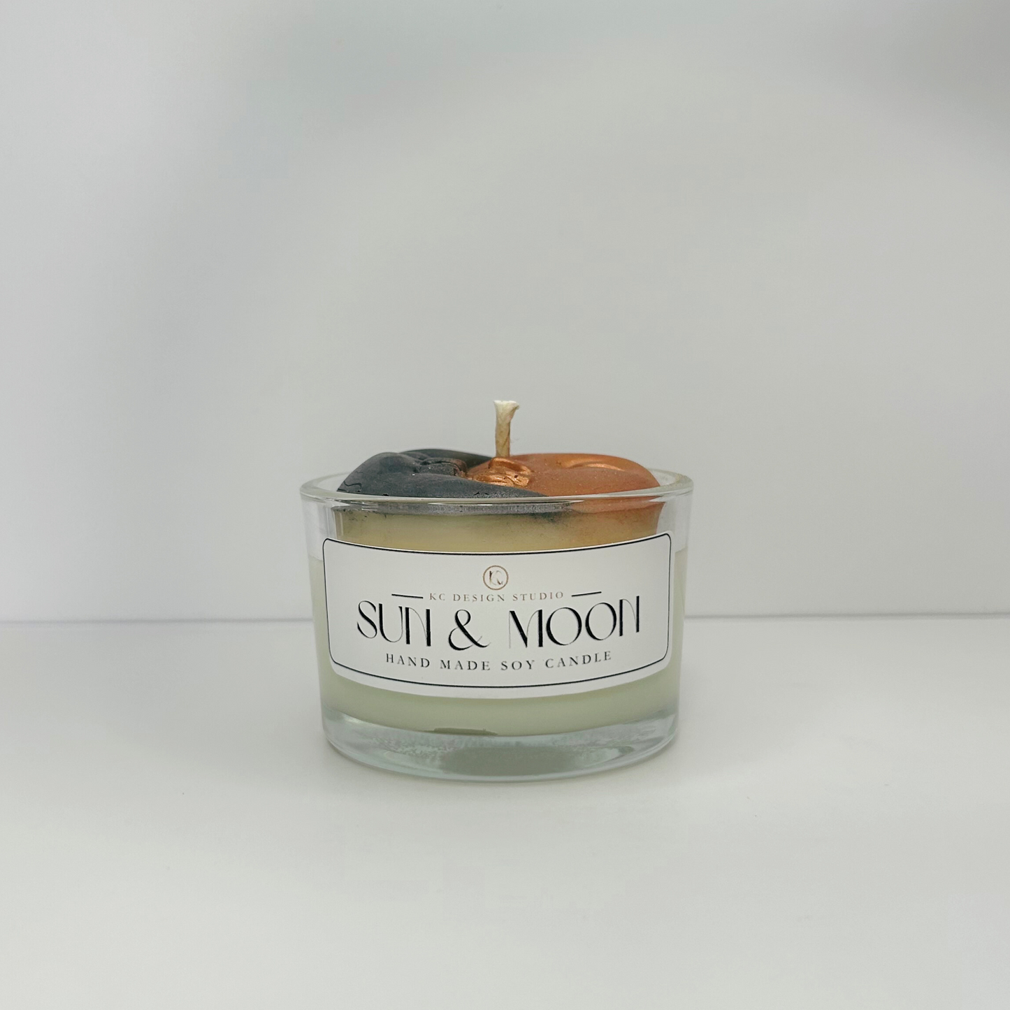 Front view of the Mini Sun & Moon Candle displaying its celestial charm and Peach Magnolia scent.