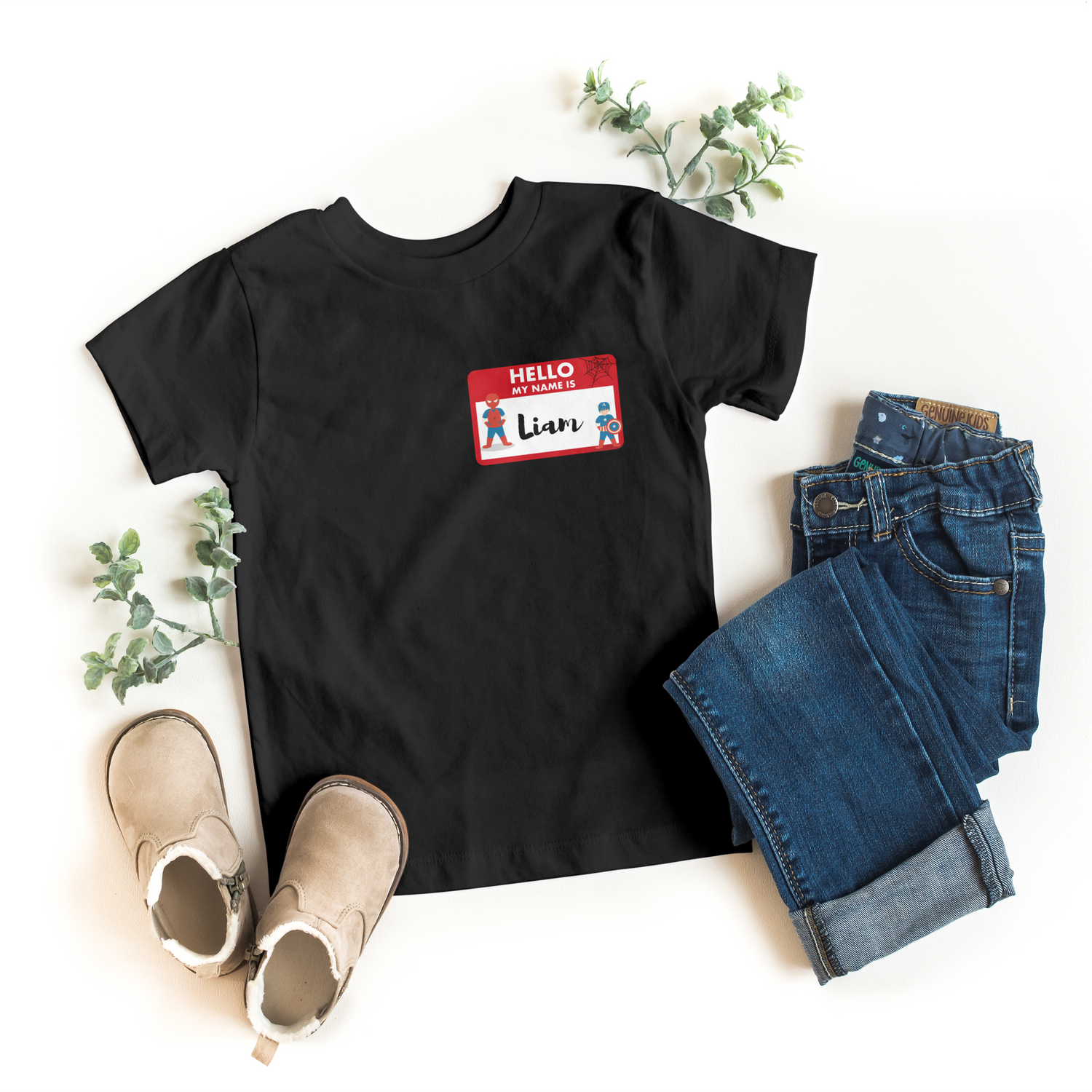 Black toddler t-shirt featuring a personalized name tag design with Spider-Man and Captain America.