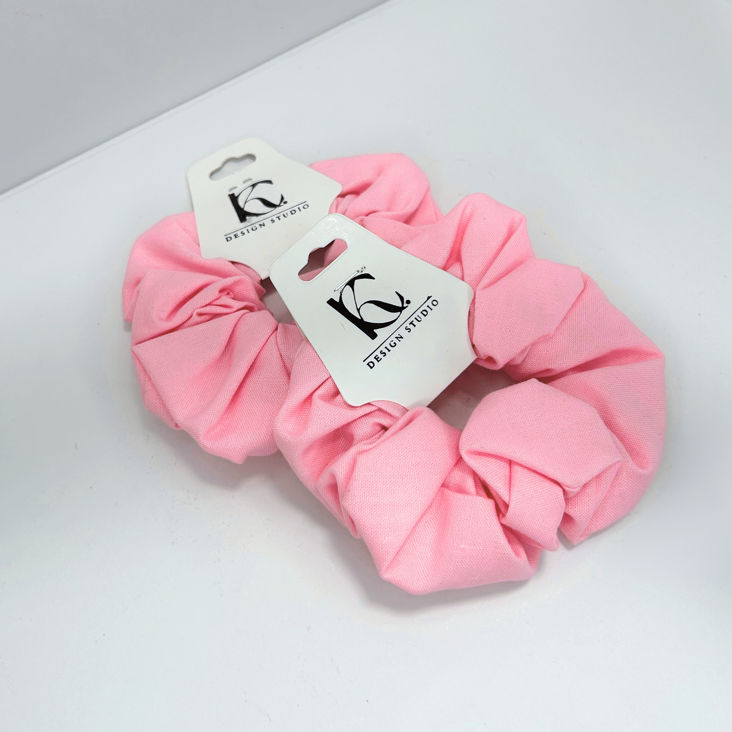 Handmade pink cotton scrunchie, stylish and gentle on hair, ideal for everyday wear.