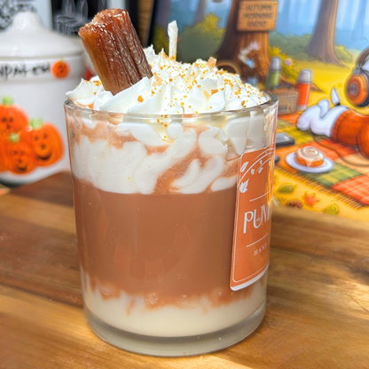 Side view of the Pumpkin Spice Latte candle highlighting the layered pumpkin spice design and detailed whipped wax topping with crumbs and cinnamon stick.