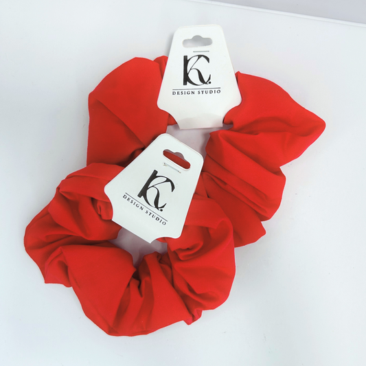 Handmade red cotton scrunchies, perfect hair accessory for any occasion.