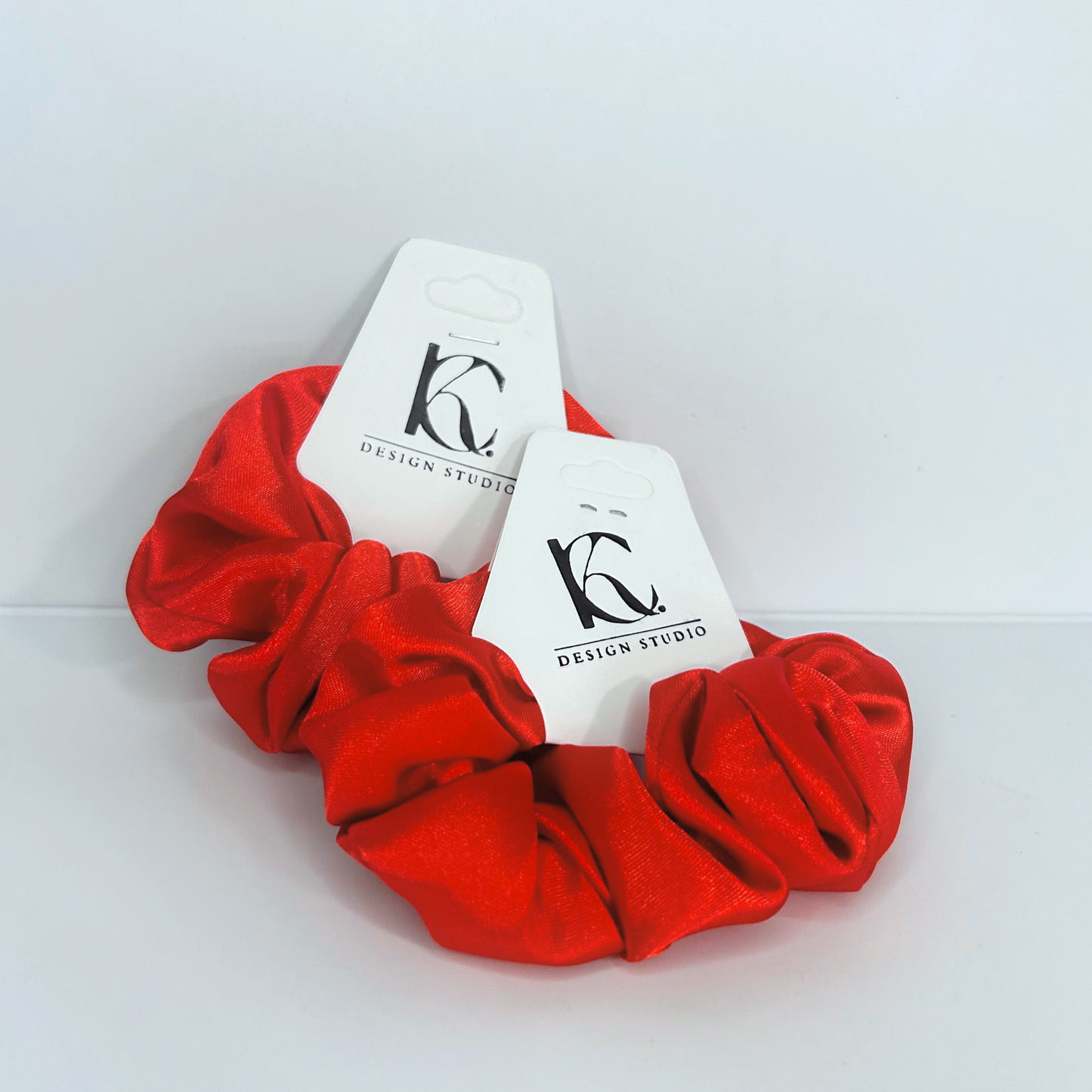 Bold red silk scrunchie perfect for a stylish pop of color.