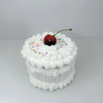 Front view of the Round Mini Cake Jewelry Box, highlighting its soft, elegant design and charming cake-inspired details.