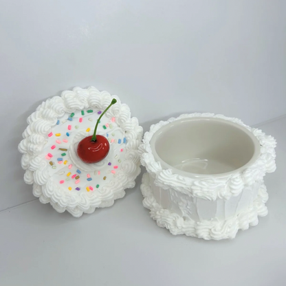 Open Round Mini Cake Jewelry Box with its lid resting against the wall, revealing a spacious interior for rings, earrings, and small treasures.