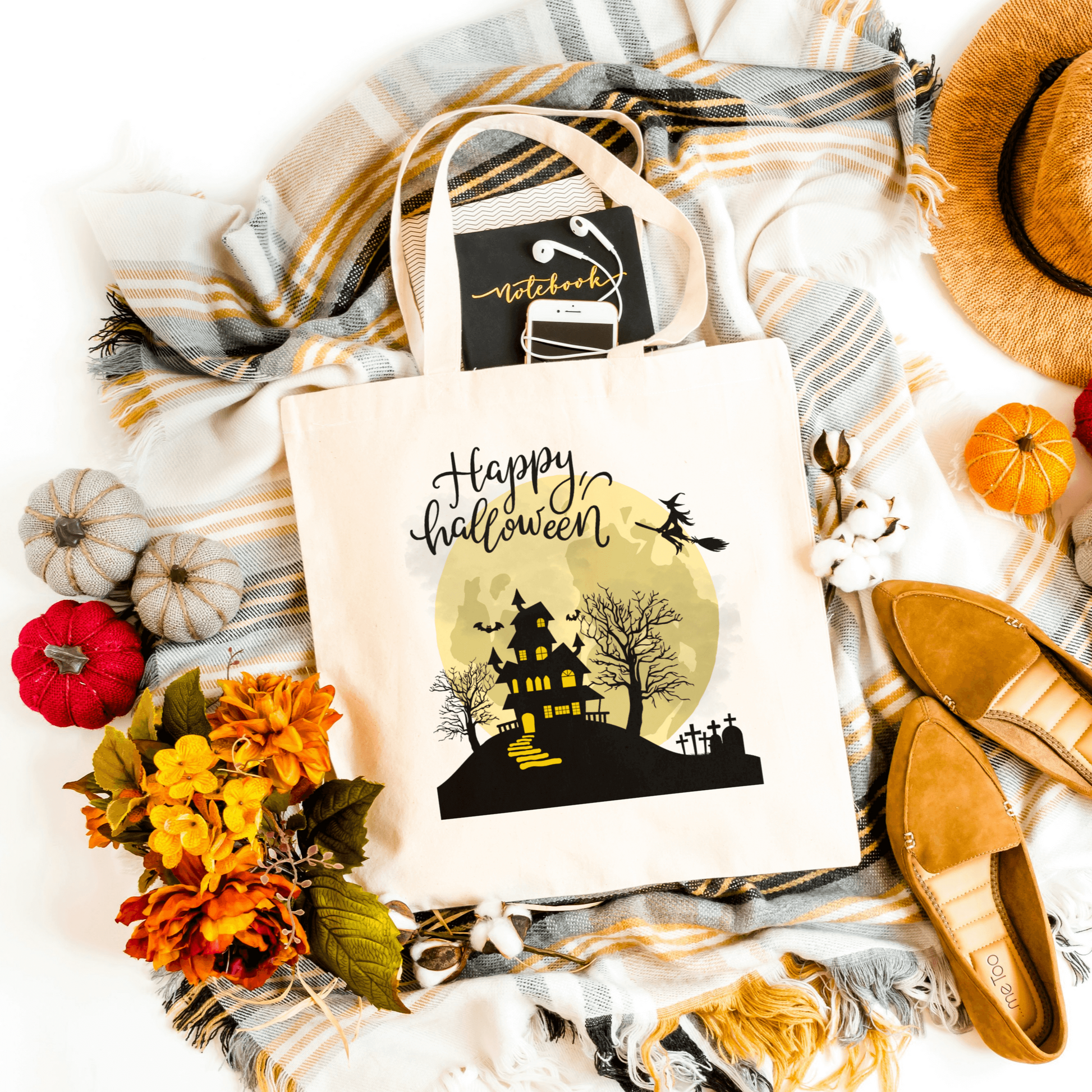 White Spooky Haunted House Tote featuring a haunted house silhouette with the words 'Happy Halloween.' Perfect for trick-or-treating and festive celebrations.