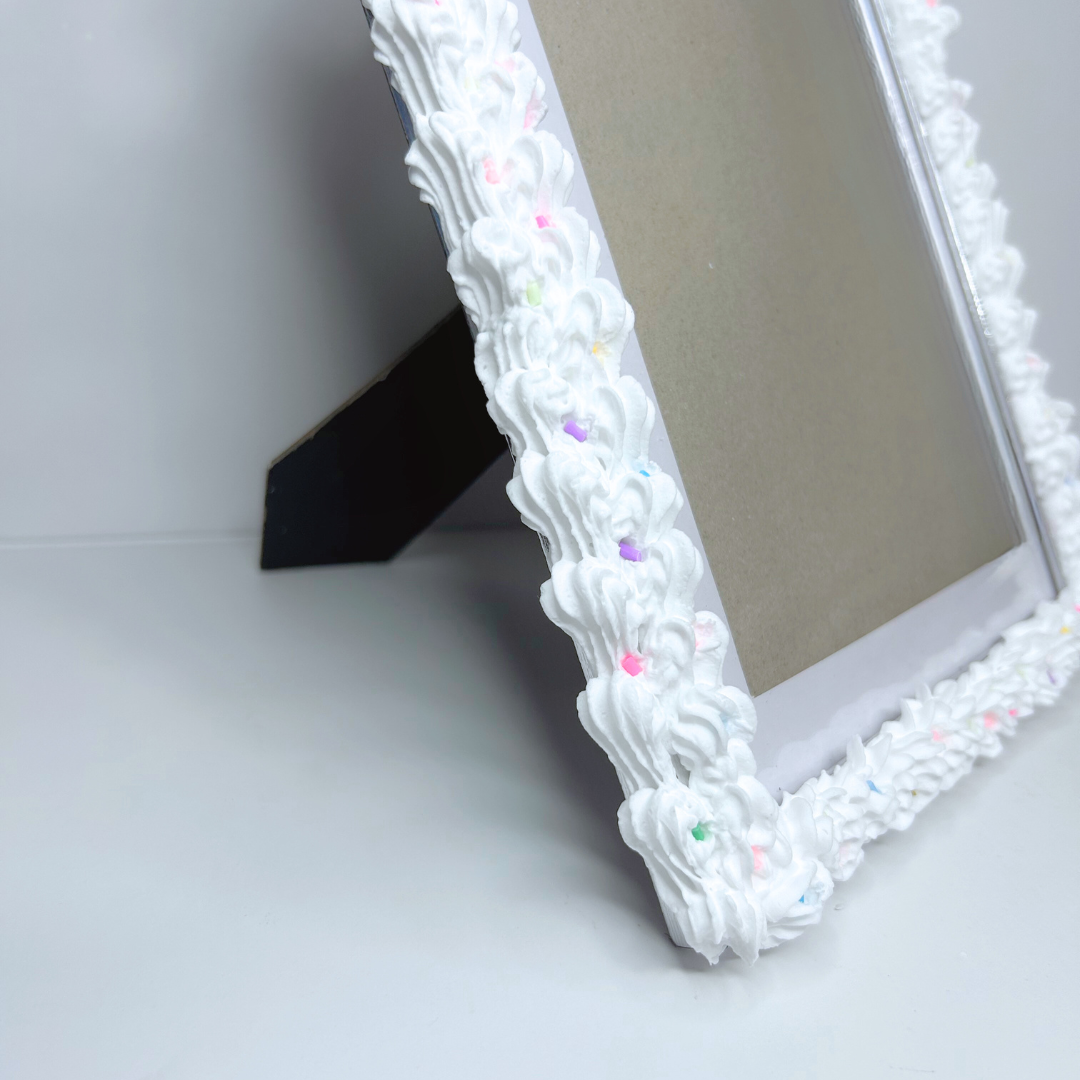 Bottom half of strawberry cake picture frame, showing the base design and easel back.