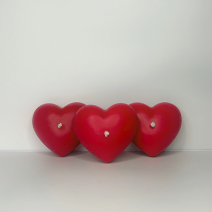 Three Decorative Full-Heart Candles displayed in front view, highlighting their charming design and sweet strawberry scent.