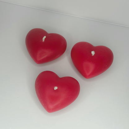 Top view of three Decorative Full-Heart Candles spaced evenly, showcasing their delightful design and colors.