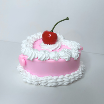 Side view of the Whimsical Vintage Heart-Shaped Jewelry Box highlighting the intricate cake-inspired design and vibrant colors