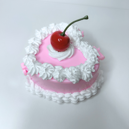 Top view of the Whimsical Vintage Heart-Shaped Jewelry Box with a cherry centerpiece and cream swirl details