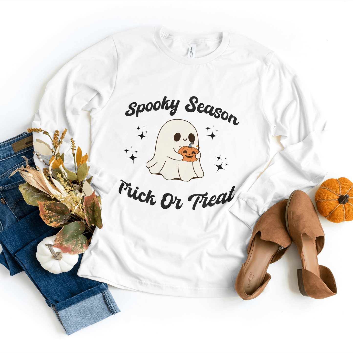 White Trick or Treat Sweatshirt showcasing a cute ghost with a pumpkin basket design, ideal for cozy fall celebrations.