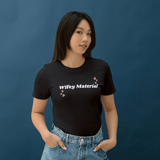 KC Design Studio Wifey Material Black T-shirt with crew neck and short sleeves, made from 100% Airlume cotton for ultimate comfort and chic style.