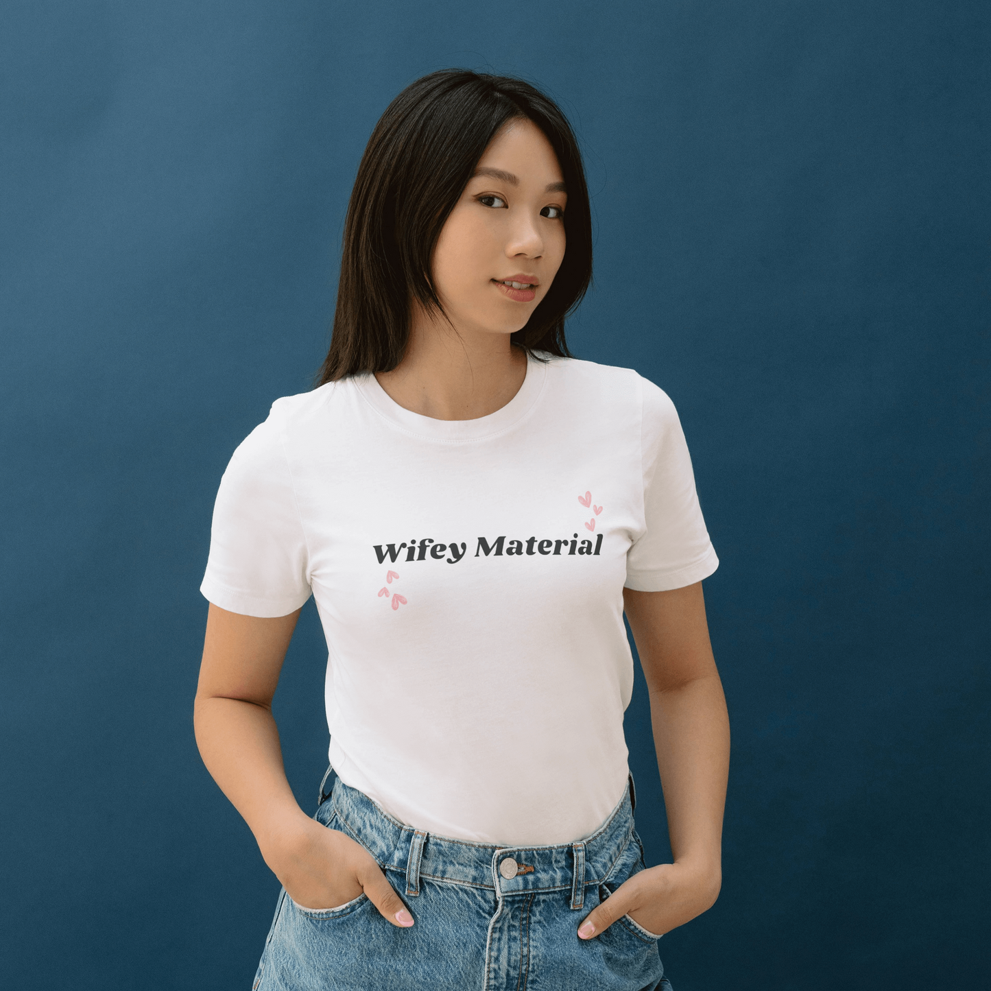 KC Design Studio Wifey Material White T-shirt with relaxed fit and short sleeves, crafted from 100% Airlume cotton, perfect for casual, chic style.